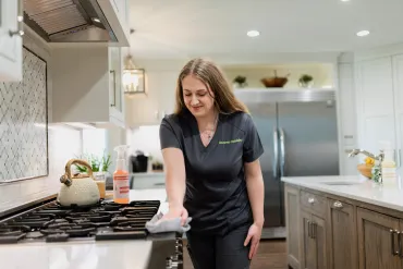 Team Member Wiping Stove